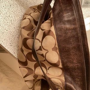 Coach leather cloth handbag with long scrap.